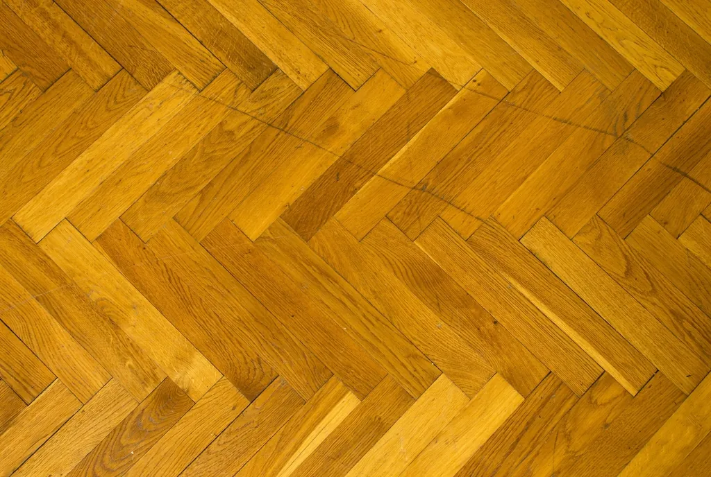 Golden herringbone parquet wood floor